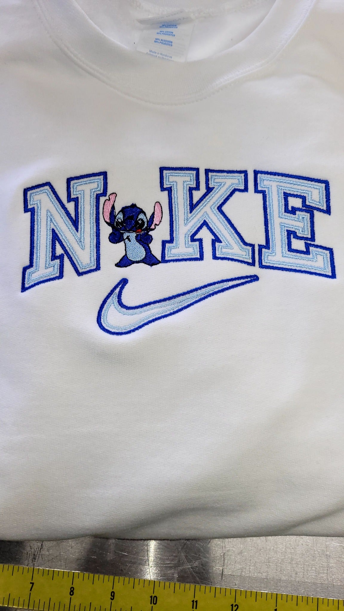 Stitch Swoosh Crewneck Sweatshirt